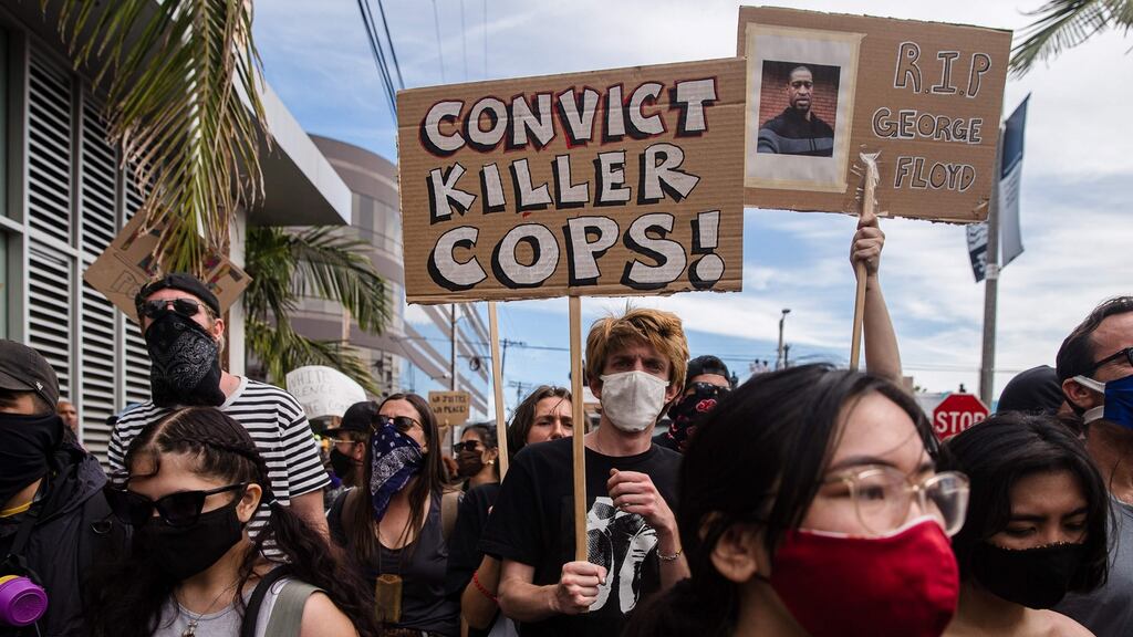 Demonstrators march to protest against the death of George Floyd, an unarmed black man who died in police custody, in Los Angeles on Saturday. Photograph: Ariana Drehsler/AFP via Getty Images