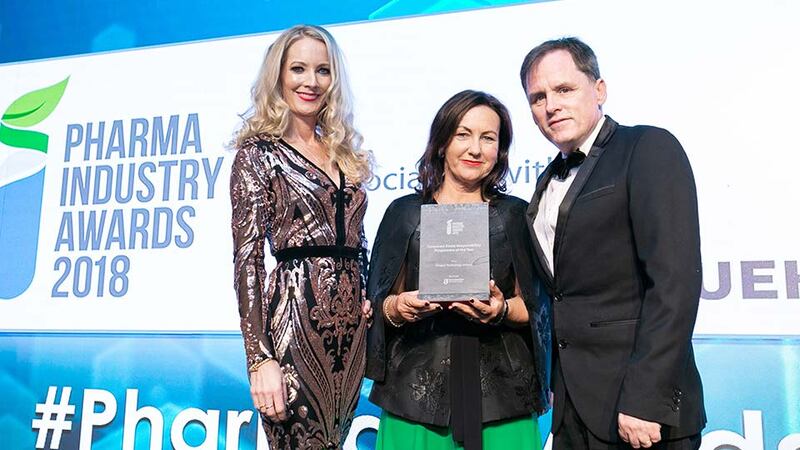 Brid O’Connell, CEO, Guaranteed Irish presents the Corporate Social Responsibility Programme of the Year award to Laoise Murchu & Ian Boyle, Amgen Technology Ireland.