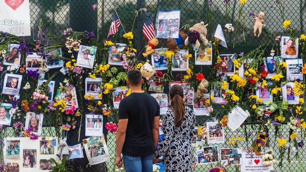People pay their respects to the victims of the Miami-area condominium tower collapse. Photograph: Saul Martinez/New York Times