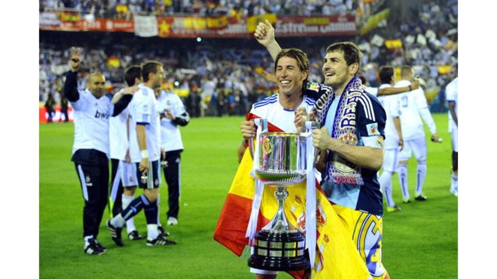 Real Madrid defender Sergio Ramos (L) in happier times with the Copa del Rey trophy alongside Madrid's goalkeeper and captain Iker Casillas (R) after the final whistle. Ramos later dropped the silverware from the open-top bus during the victory parade. Photograph: Pierre-Philippe Marcou/AFP/Getty Images