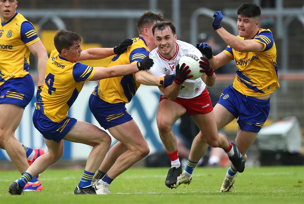 Roscommon's Robbie Dolan, Daire Cregg and Niall Higgins tackle Darragh Canavan of Tyrone. Photograph: Leah Scholes/Inpho