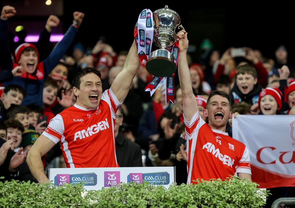 Cuala’s James Power and Luke Keating raise the Andy Merrigan Cup after their All-Ireland club football final victory over Tyrone's Errigal Ciarán on Sunday. Photograph: Bryan Keane/Inpho