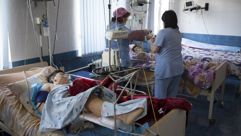 Vardan Andreasyan (left, aged 12), and Gevorg Grigoryan (12), who were wounded in shelling during clashes between Armenian and Azeri forces in the Nagorno-Karabakh region, are treated at a hospital in Nagorno-Karabakh’s main city of Stepanakert. Photograph: Areg Balayan/Pan Photo/Reuters
