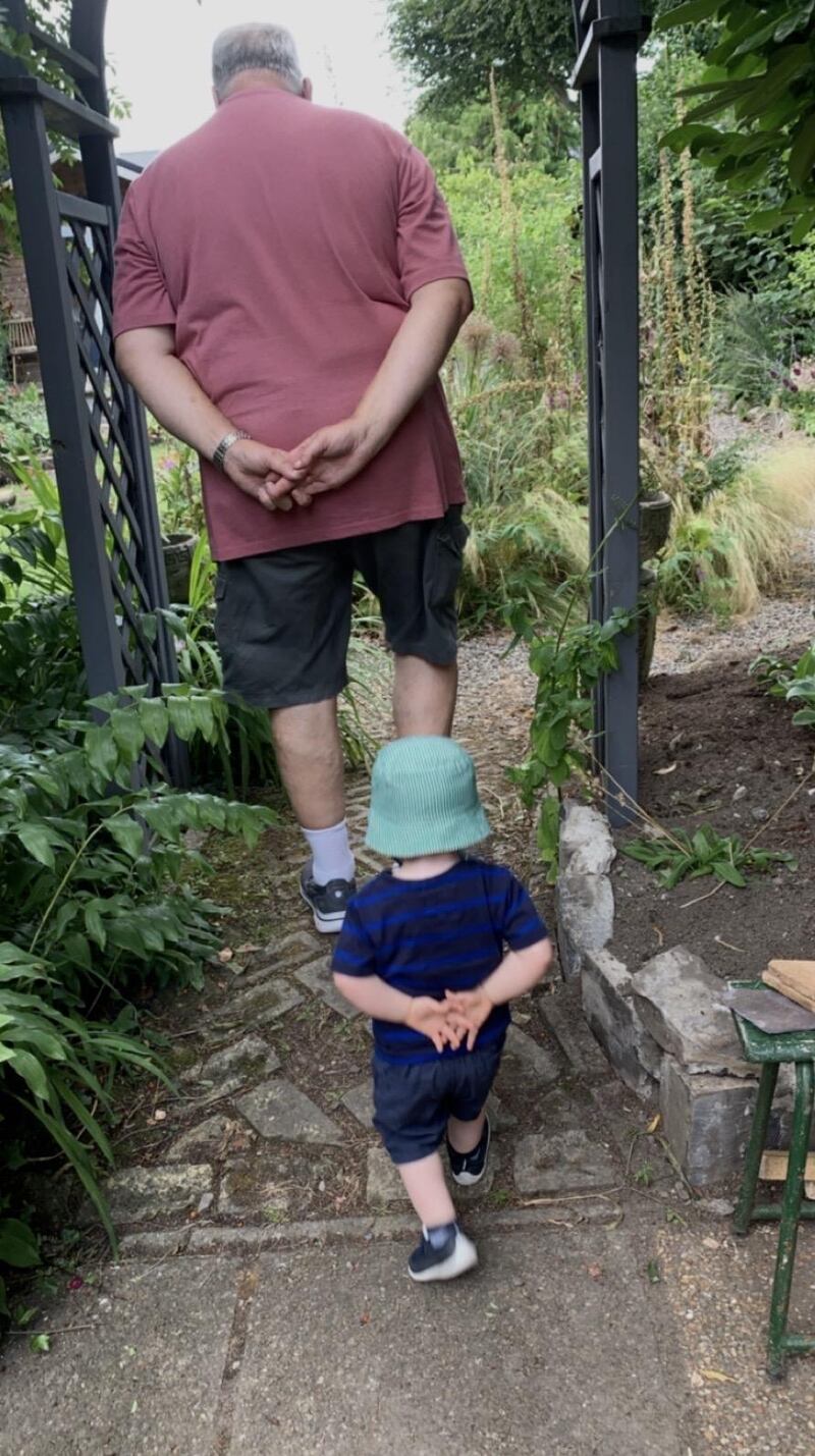 David Seaman followed by his “shadow”, his two-year-old grandson Ruairí, at home in Celbridge, Co Kildare. Photograph: Rachel Seaman