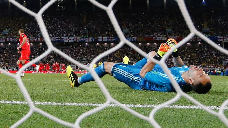 David Ospina lies on the ground after being beaten by the penalty of Eric Dier. Photo: Peter Powell/EPA