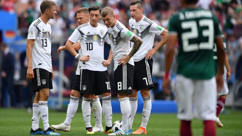 Mesut Özil next to Toni Kroos after Germany’s World Cup defeat to Mexico in Moscow. Photograph: Hector Vivas/Getty
