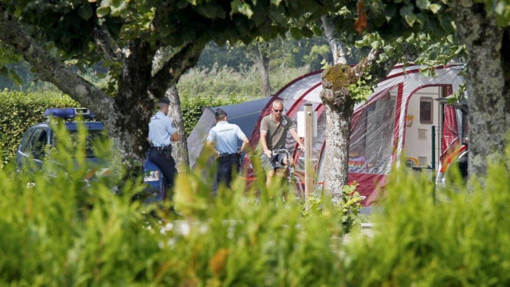 French gendarmes stand guard next to a caravan at Saint-Jorioz camping ground, near Annecy where Saad al-Hilli and his wife Ikbal, from Claygate in Surrey, and her mother Suhaila al-Allaf, who lived in Sweden, were all fatally shot. Photograph: Robert Pratta/Reuters.