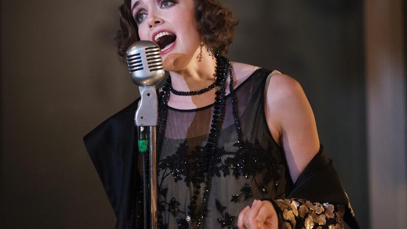 Myrtle (Aoibheann McCann): “Black evening dress in tulle with handkerchief points – sequinned coat with Poiret-style roses in matt sequins all over,” says Peter O’Brien.Photograph: Agata Stoinska
