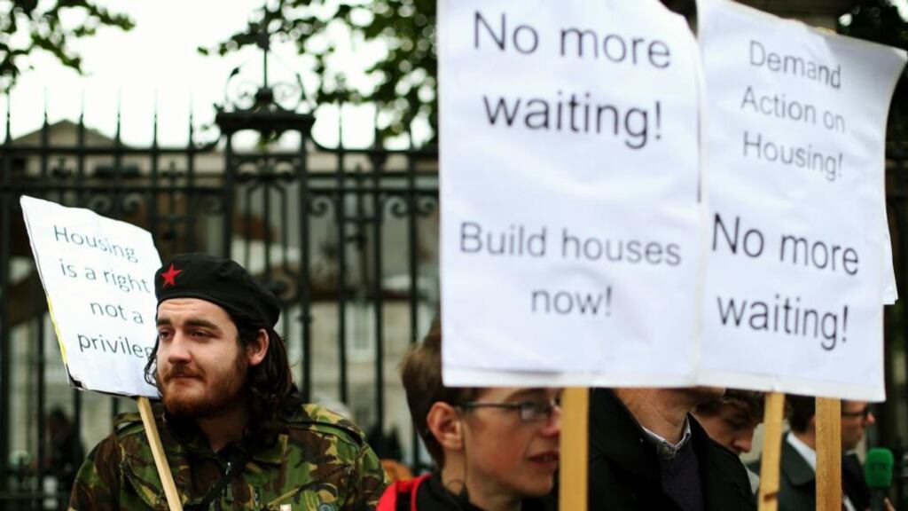 ‘An increase in €10 million has been allocated directly to provide accommodation and services to homeless people. Again, an increase in funding is always welcome and comes as a surprise, but given the scale of the problem, with over five new people becoming homeless every day in the Dublin area alone, it will not be sufficient to give everyone a bed for the night.’ Above, demonstrators outside Leinster House, as Minister for Finance Michael Noonan delivered Budget 2015. Photograph: Brian Lawless/PA