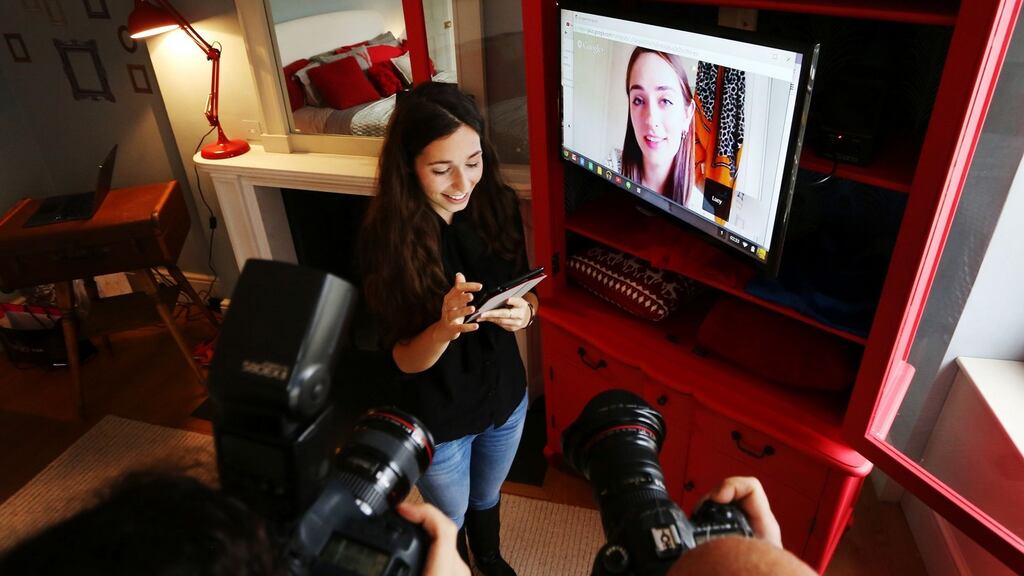 Googler Saskia Clifford-Mobley uses a Google Nexus 7 tablet to demonstrate Google Hangout features during a live demonstration of Google Voice Service capabilities in London. Photograph: Gareth Fuller/PA Wire