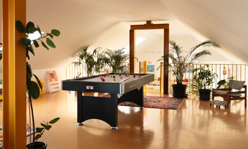 The 65sq m mezzanine is home to a pool table, a gaming zone, a workstation for Eamonn and a sewing table for Liz. Floored in cork tiles, an homage to the 1970s, 'it brings a lovely warmth', Liz says