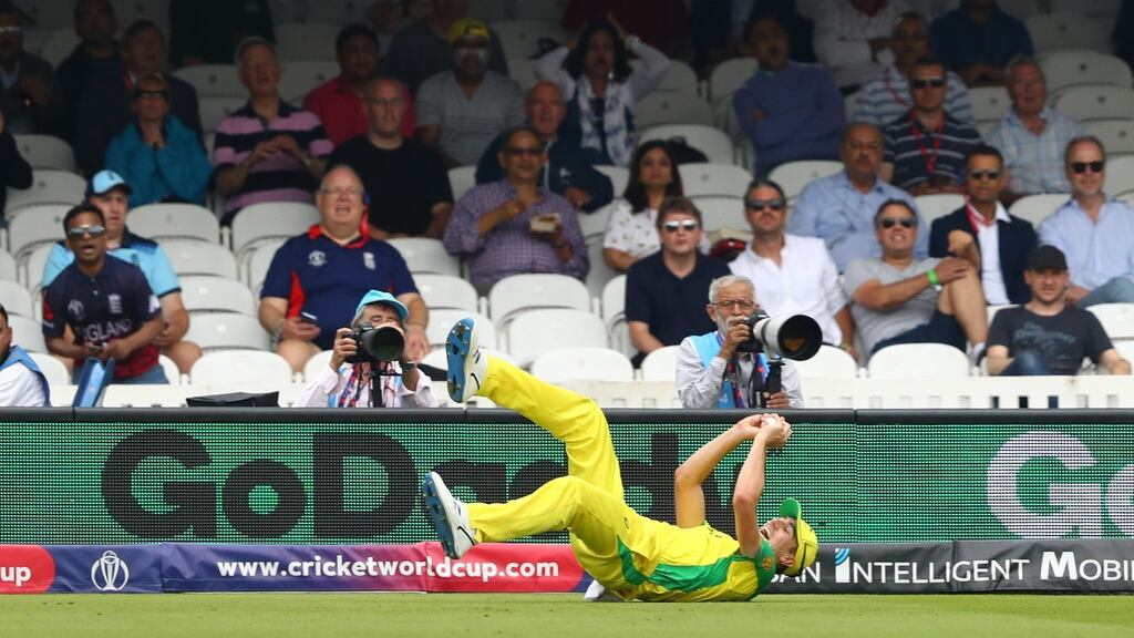 Pat Cummins takes a catch off the bowling of Mitchell Starc to dismiss England captain Eoin Morgan. Photograph:  Michael Steele/Getty Images