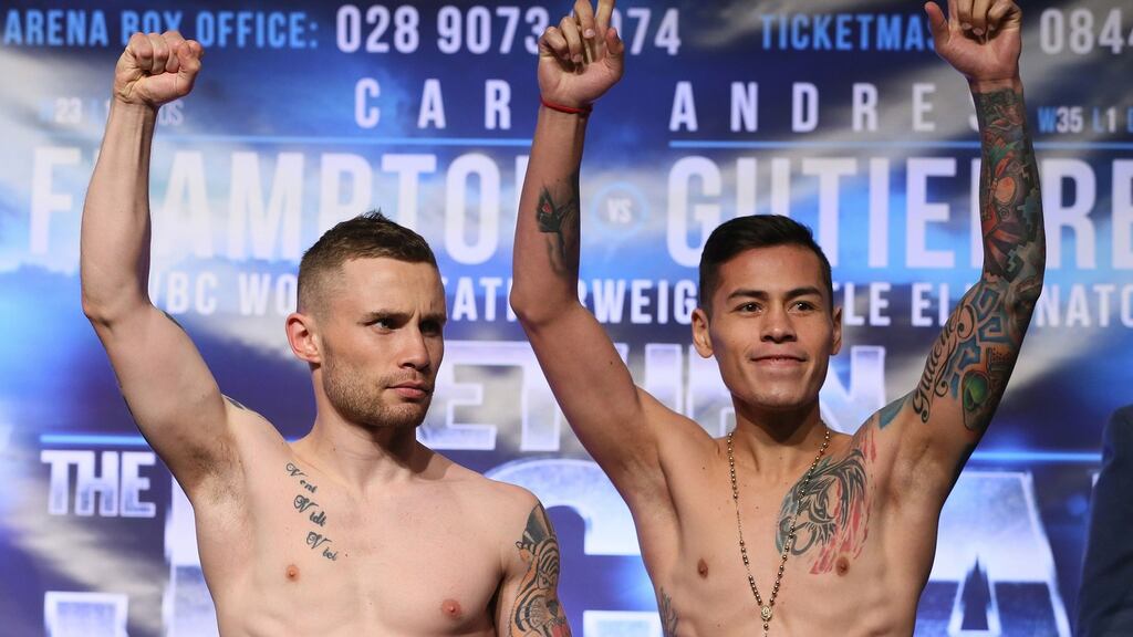 Carl Frampton (left) and Andres Gutierrez during the weigh-in at the Europa Hotel, Belfast. The fight was cancelled after Gutierrez suffered facial injuries in a slip in a hotel shower. Photograph: Brian Lawless/PA Wire.