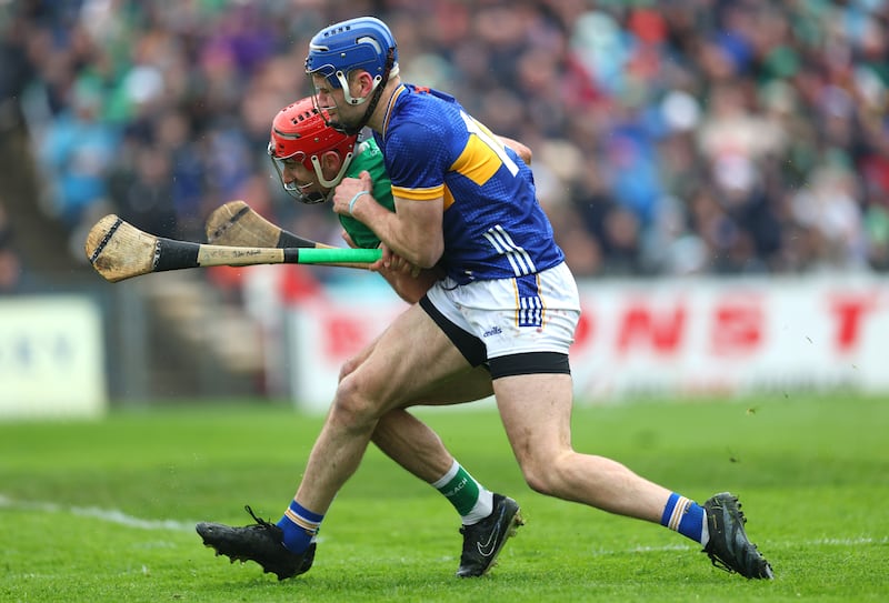 Limerick’s Barry Nash and John McGrath of Tipperary. Photograph: James Crombie/Inpho