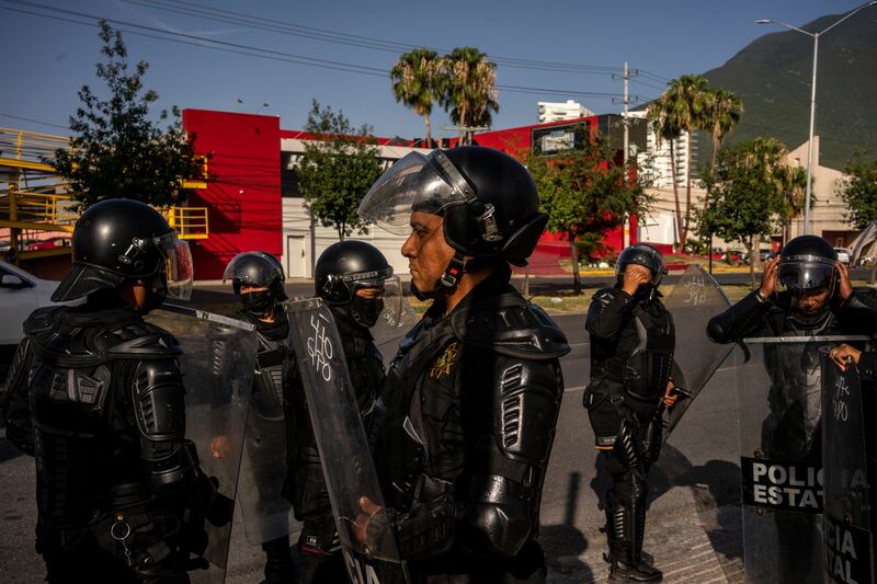 Police officers stand guard where demonstrators had called for a protest to demand more water in Monterrey. Photograph: Cesar Rodriguez/New York Times