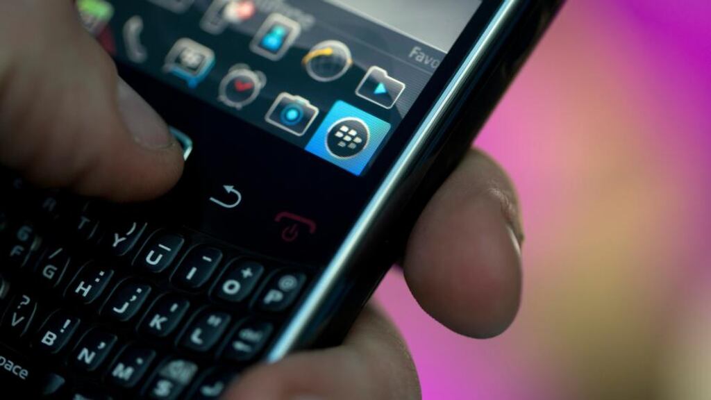 The BlackBerry querty keyboard, logo and icons are seen on the screen of a BlackBerry Curve smartphone. BlackBerry said it reached a tentative agreement for a $4.7 billion buyout by a group led by Fairfax Financial Holdings, its biggest shareholder. Photograph: Simon Dawson/Bloomberg
