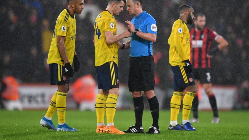 Granit Xhaka gets a talking to off Stuart Attwell during Arsenal’s defeat to Bournemouth. Photograph: Dan Mullan/Getty
