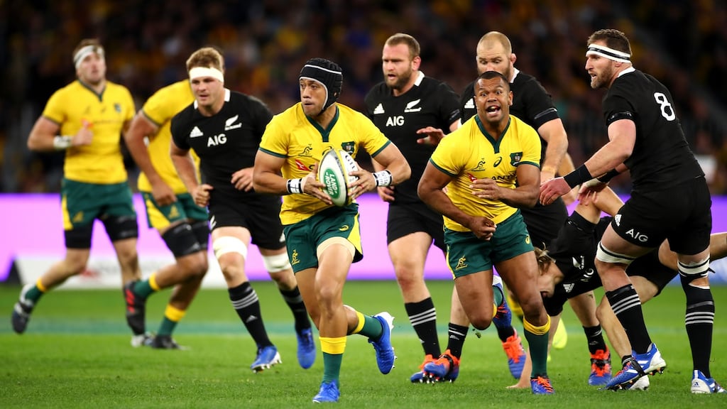 Australia outhalf Christian Lealiifano, supported by Kurtley Beale, runs the ball during the Rugby Championship match against New Zealand at Optus Stadium in Perth. Photograph: Cameron Spencer/Getty Images
