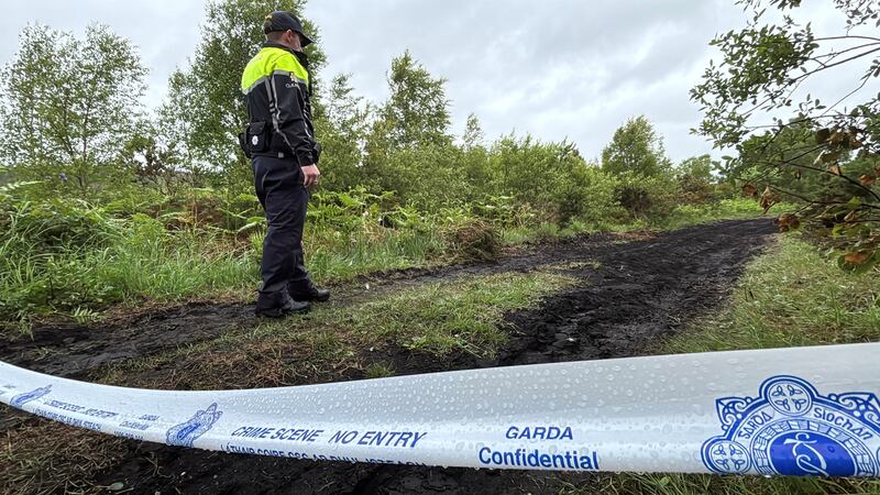 A garda during a search operation on open ground in Graigue, Killeigh, Co Offaly, part of the investigation into the disappearance of Fiona Pender from Co Offaly almost 29 years ago. Photograph: Niall Carson/PA Wire