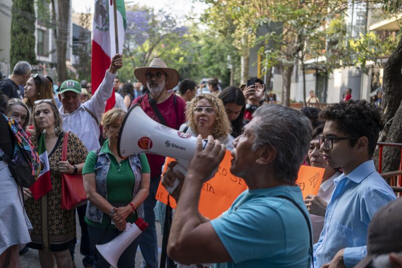 Demonstrators protest outside of the Ecuadorian embassy in Mexico City, Mexico, on Saturday Photograph: Stephania Corpi/Bloomberg