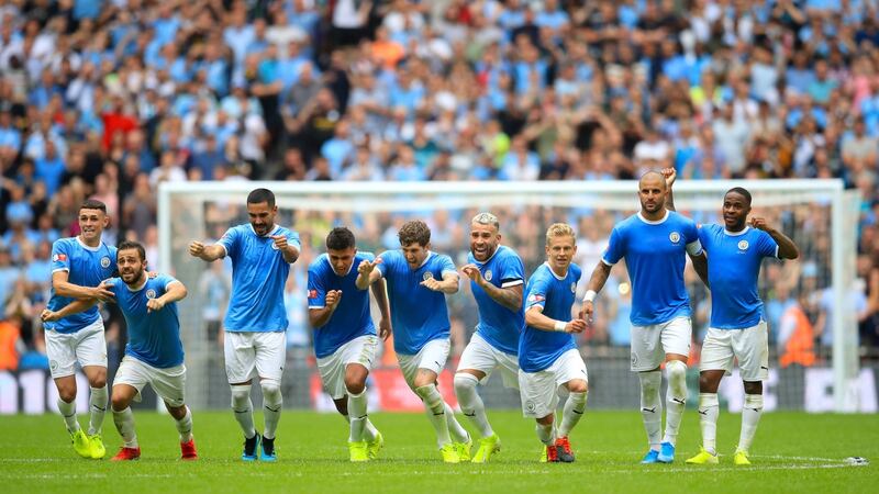 Manchester City celebrate their penalties win over Liverpool. Photograph: Adam Davy/PA