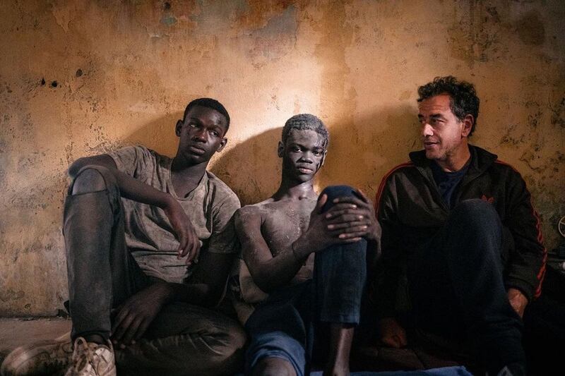 Director Matteo Garrone (right) with Seydou Sarr and Moustapha Fall on the set of Io Capitano. Photograph: Pathé