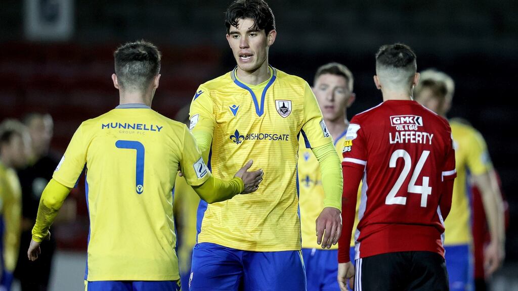 Longford’s Dylan Grimes and Rob Manley celebrate after the game. Photo: Bryan Keane/Inpho