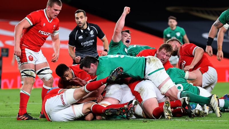 Cian Healy celebrates Quinn Roux’s first half try against Wales. Photograph: Billy Stickland/Inpho
