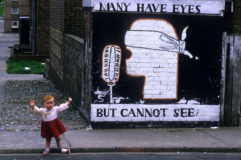 A girl in front of a mural in Derry criticising the media in 1985. Photograph: Kaveh Kazemi/Getty Images