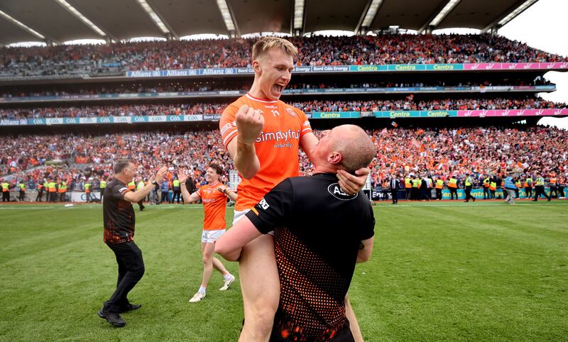 Armagh's Rian O'Neill and Kieran Donaghy celebrate after the game. Photograph: Bryan Keane/Inpho