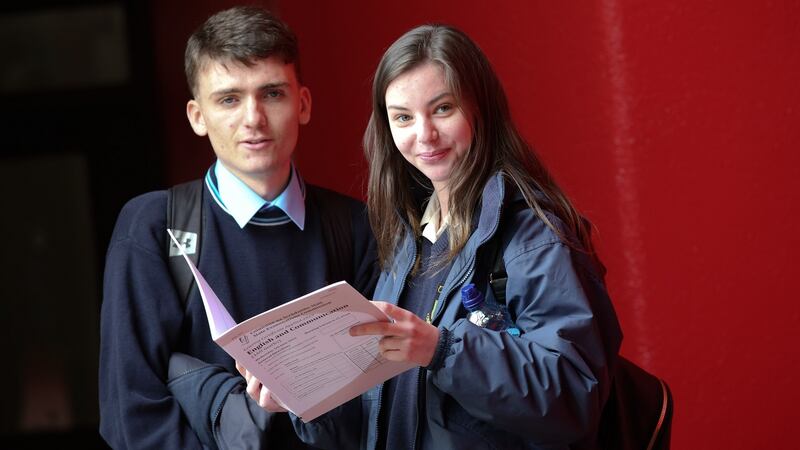 Applied Leaving Certificate students, Louis Murphy and Skyi Tobin with the English and Communication paper after they sat the exam at St Tiernan’s Community College in Dundrum, Dublin. Photograph: Laura Hutton/The Irish Times