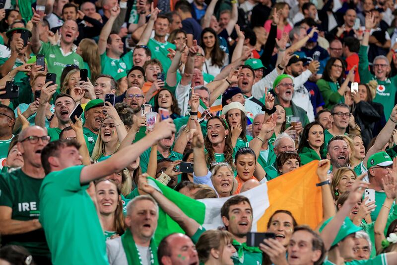 Ireland fans celebrating after the game against Scotland. Irish fans will not come to Saturday's quarter-final as cheerleaders. They will come as 'part of the problem' for the All Blacks. Photograph: Dan Sheridan/Inpho