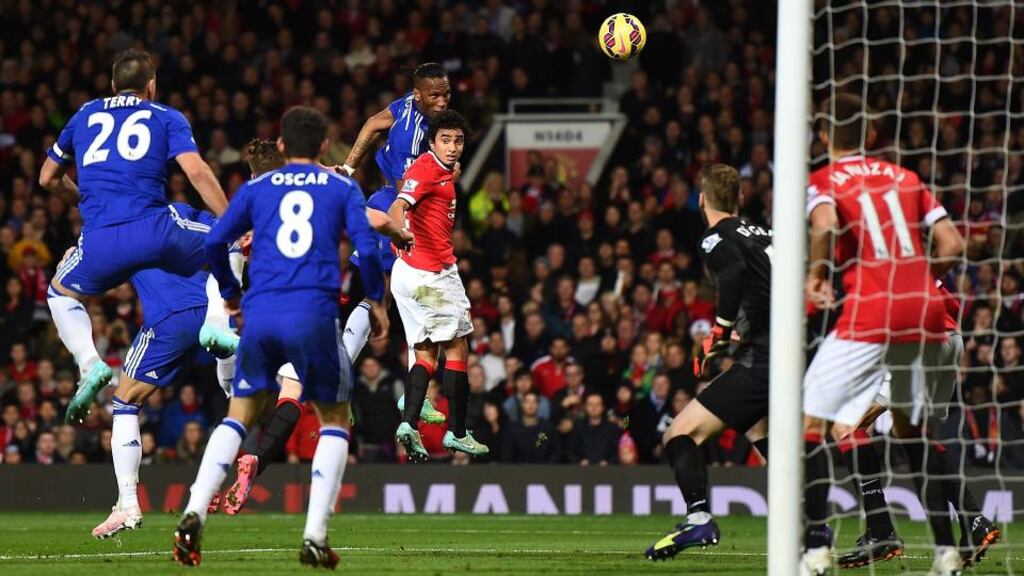 Chelsea’s Didier Drogba rises above Manchester United’s Rafael to head home during the Premier League game at Old Trafford. Photograph: Laurence Griffiths/Getty Images