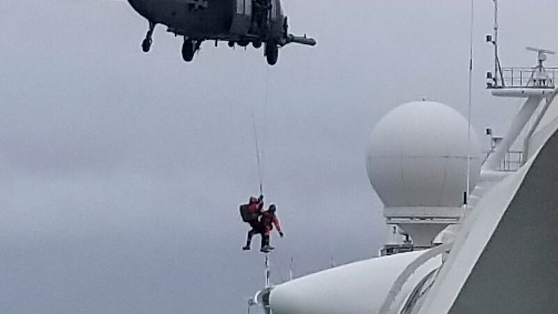 Coast Guard helicopter delivering virus testing kits lowers crew down to the Grand Princess cruise ship on Thursday.  Photograph: Michele Smith/AP