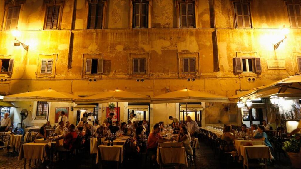 Customers eat dinner at a restaurant in downtown Rome this week. “The main obstacle to growth in Italy is the government.” Photograph: Reuters