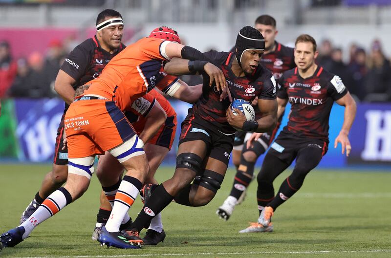 Maro Itoje of Saracens is tackled by Grant Gilchrist during the Heineken Cup match between Saracens and Edinburgh at StoneX Stadium in Barnet, England on December 11th, 2022. Photograph: David Rogers/Getty Images