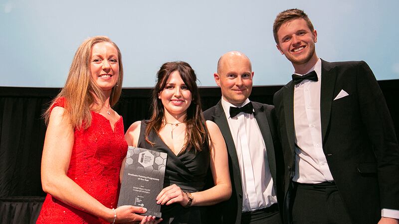 Susan Castello, Network Manager, BioPharmaChem Skillnet, presents the Graduate Training Programme of the Year award to the Bristol Myers Squibb Cruiserath Biologics team.