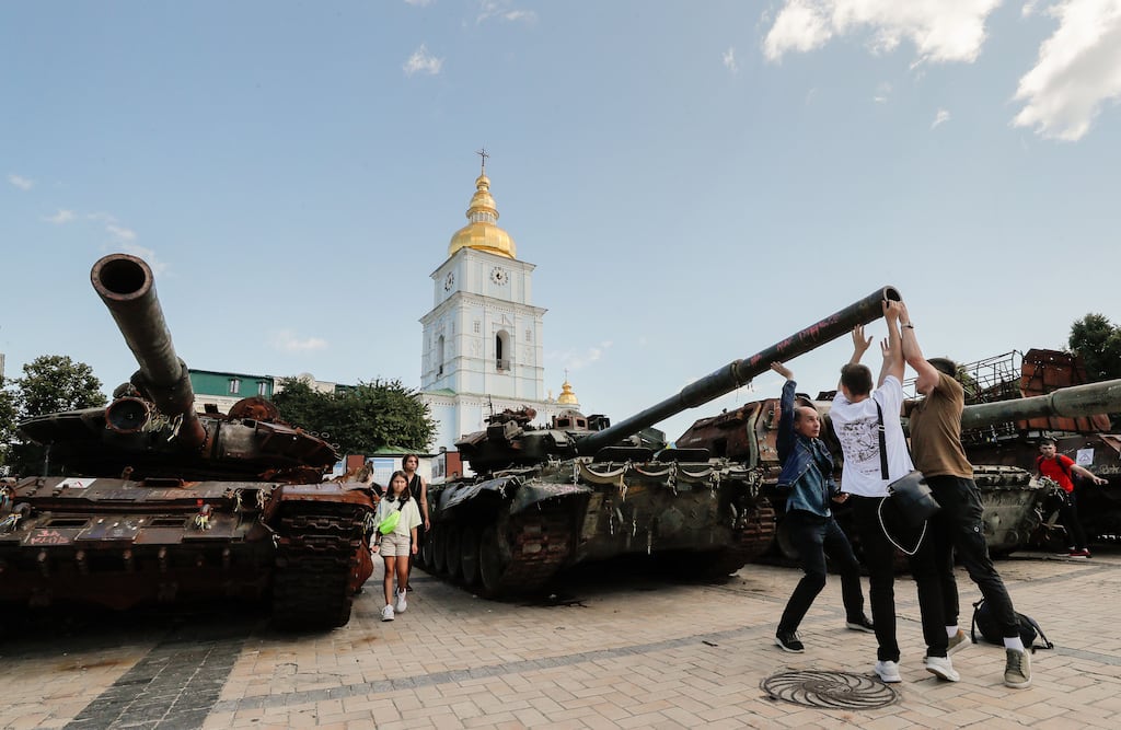 Ukrainians visit an exhibition of destroyed Russian military vehicles displayed in front of St Mikhailovsky Cathedral in Kyiv. Photograph: Sergey Dolzhenko/EPA