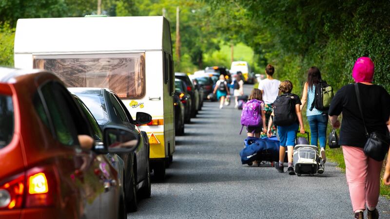 Festival-goers walking to All Together Now at Curraghmore, Co Waterford. There were hours of traffic delay getting to the venue. Photograph: Patrick Browne