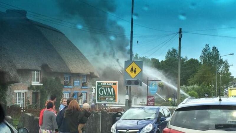Adare village was closed for most of Saturday as six fire crews from Limerick County accompanied by additional crew from the city, battled the fire for several hours. Photograph: Barry O’Halloran