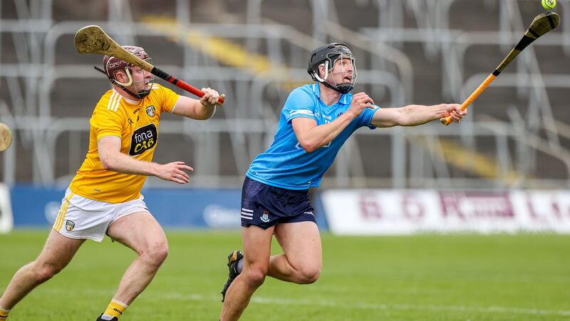 Dublin’s Donal Burke is challenged by Antrim’s Eoghan Campbell. Photograph: John McVitty/Inpho
