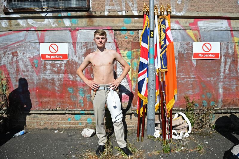 A member of a flute band prepares to take part in the annual Twelfth of July parade. Photograph: Charles McQuillan/Getty