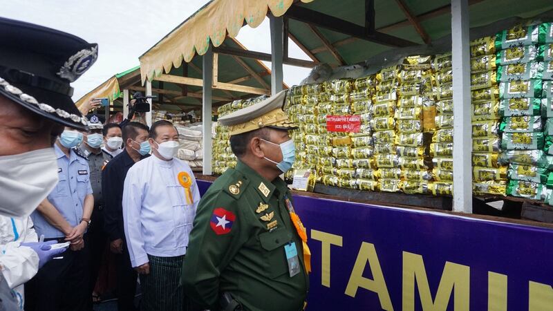 Myanmar’s minister of home affairs, lieutenant general Soe Htut, examines seized drugs in Yangon in June. Photograph: AFP via Getty Images