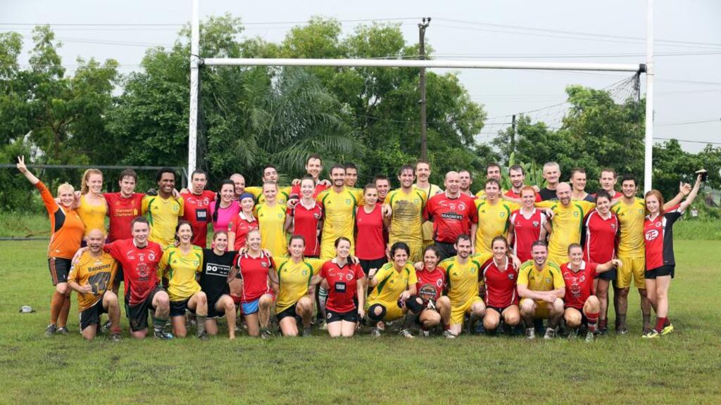 The Myanmar Celts and the Singapore Lions pose together after the first Gaelic football game to be played in Myanmar
