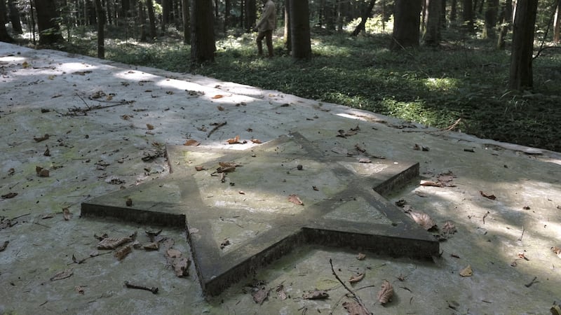 The Star of David on a huge concrete slab marking a mass grave of Jews killed by Nazis during the second World War in the forest of Bronytsya, near Drohobych in Lviv Oblast, Ukraine.