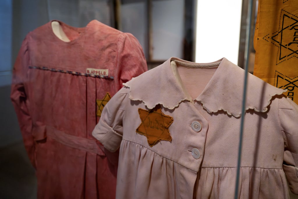 Dresses bearing the Jewish yellow-star at the National Holocaust Museum in Amsterdam. Photograph: Nick Gammon /ANP/AFP via Getty Images