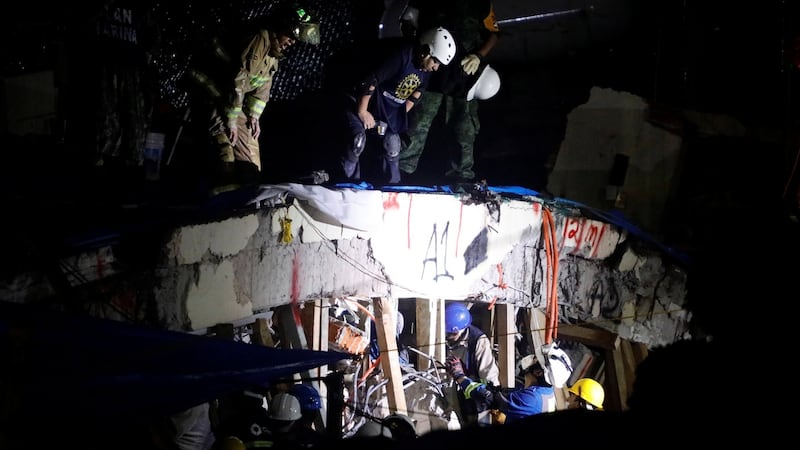 Rescue workers search through the rubble for students at Enrique Rebsamen school after an earthquake in Mexico City, Mexico. Photograph: Edgard Garrido/Reuters