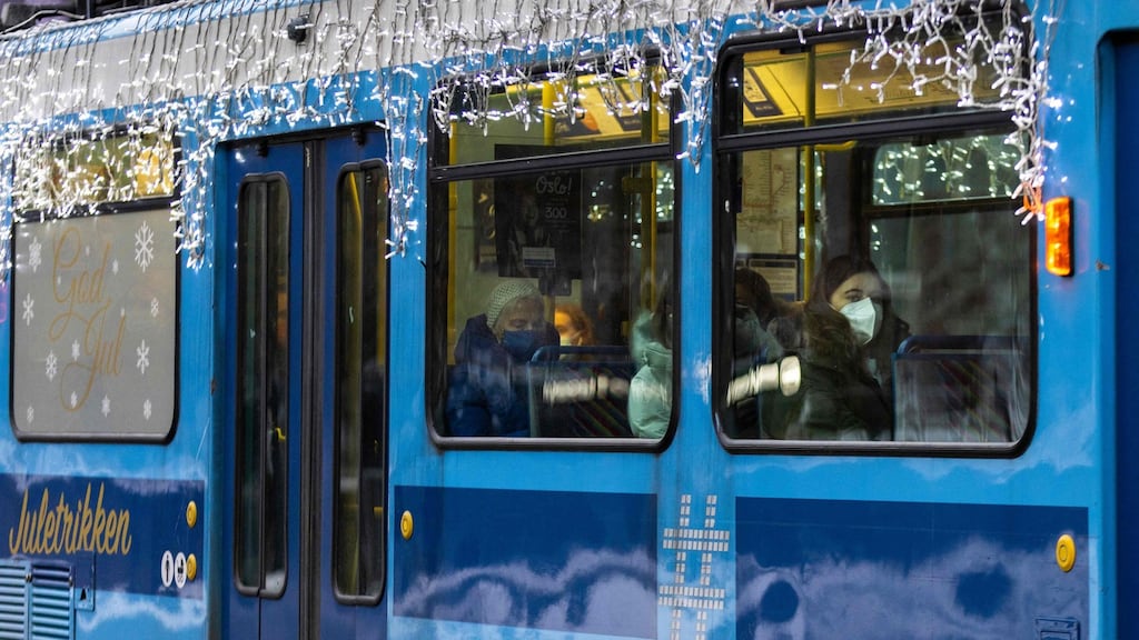 People wearing protective face masks on a tram in Oslo, Norway. As Covid cases soar, Norway’s centre-left government on Monday evening introduced a range of new restrictions including a ban on serving alcohol in bars and restaurants. Photograph: Odd Andersen/AFP via Getty Images