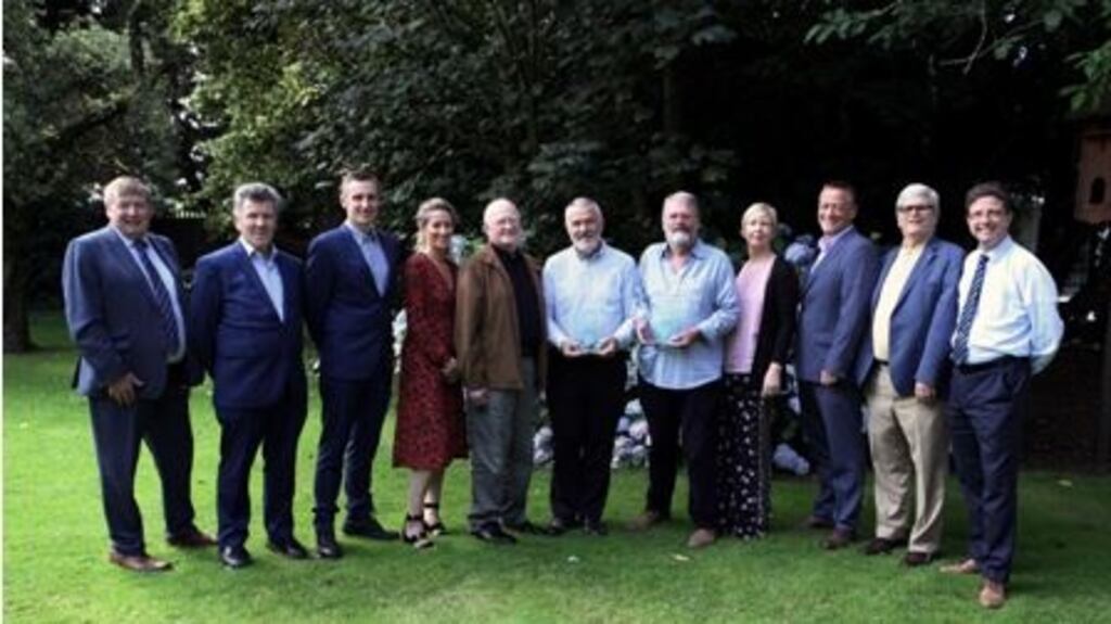 Jim Walsh and William Hammond (centre in light blue shirts) have been organising the Cork Folk Festival on a voluntary basis over the last 40 years. Photograph: Tony O’Connell photography