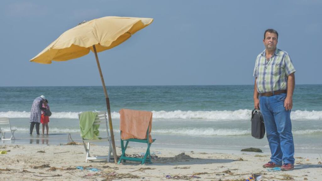 Ibrahim Talal, from Syria, on Agamy Beach, Alexandria: “This is not where I want to be.” Photograph: Peter Biro/European Union/Echo